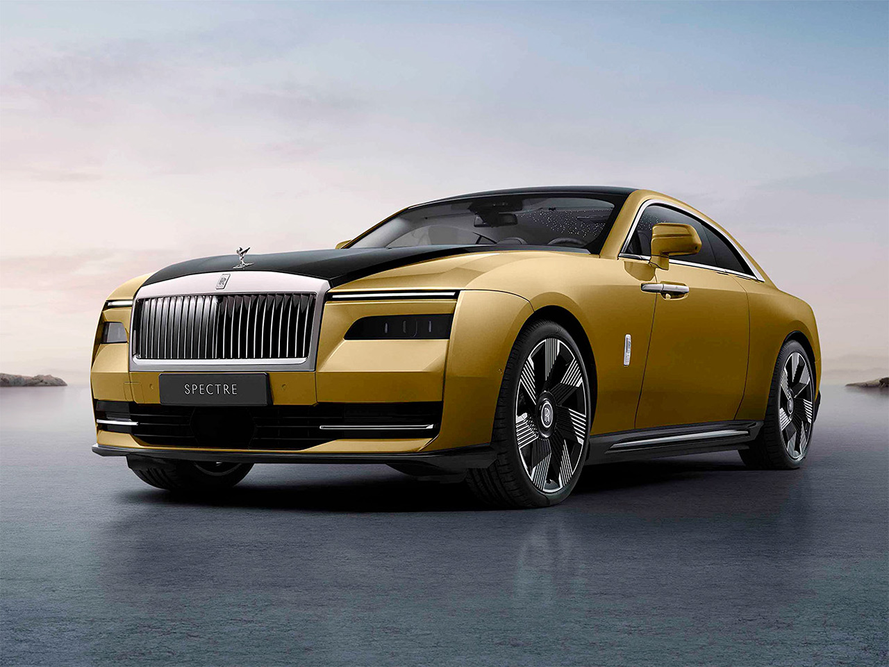 Black and golden Rolls-Royce Spectre during sunset