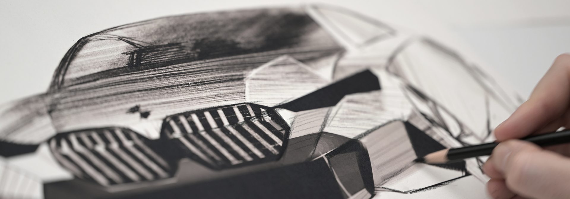 Someone is sketching a BMW vehicle