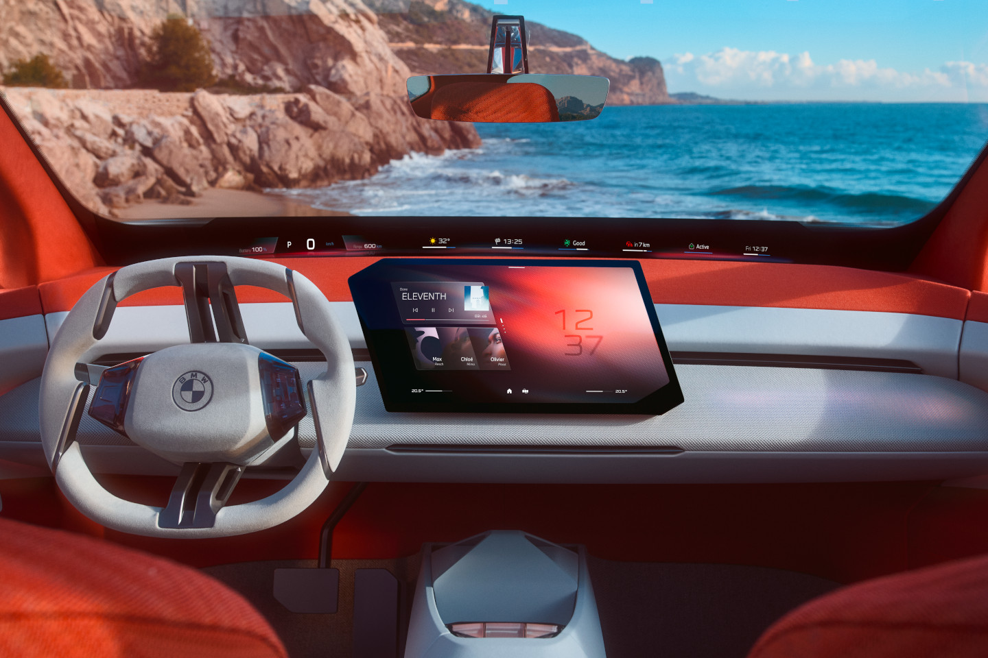 Futuristic BMW interior with red upholstery, central touchscreen, and view of coast and sea through the windshield.