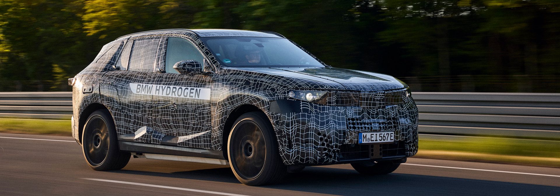 A camouflaged BMW iX5 Hydrogen on the test  track.