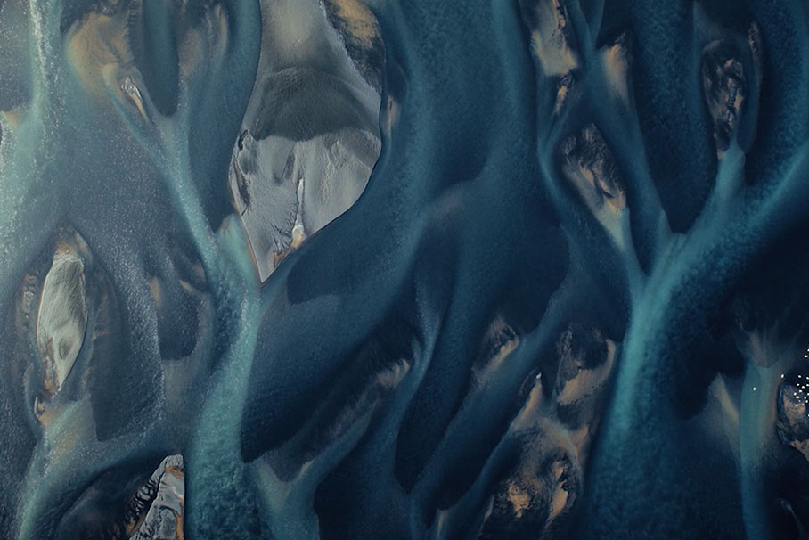 Abstract shapes formed by water in a stunning aerial photograph.