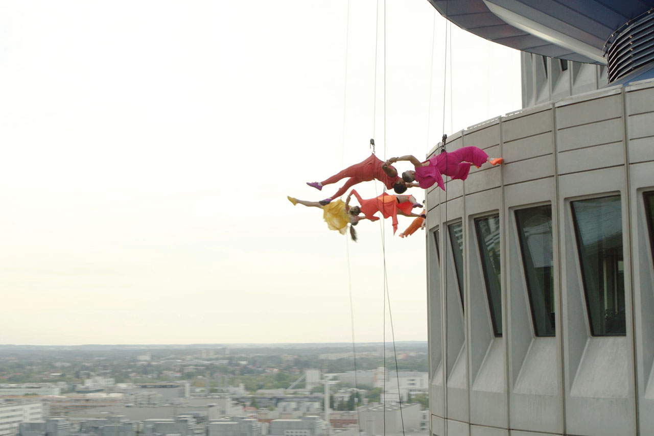 Bandaloop performing on the facade of the BMW four-cylinder