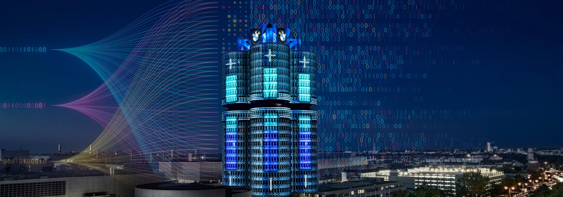 Der BMW Vierzyllinder, der in blauen Lichtern erstrahlt, vermittelt ein futuristisches und elegantes Stadtbild.