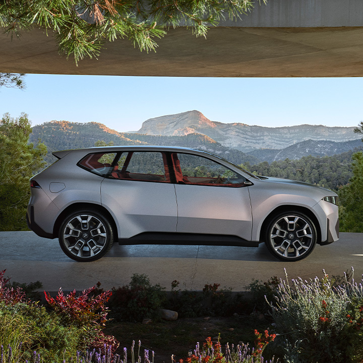 BMW iX3 Neue Klasse illustrated infront of the mountains.