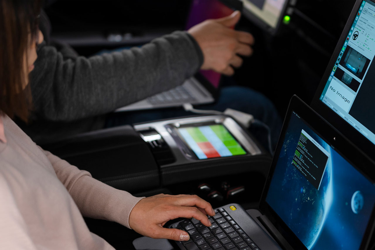 The Tech team is testing cars with their computers