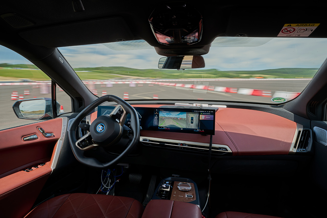A BMW vehicle is driving fully automated through a test course